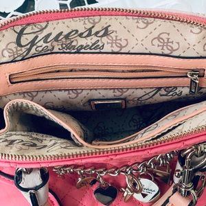 pink guess purse with charms